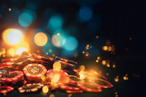 DEWA700 — A high-class gaming experience without limits A woman in a luxurious green gown next to an ornate roulette wheel, capturing the upscale casino mood of DEWA700.